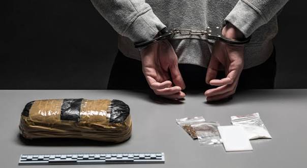 Drug possession charges - legal guide with handcuffs and gavel